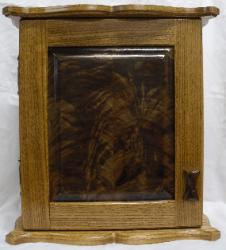 Necklace cabinet, Red Oak (golden oak stain) with crotch figured walnut panel.